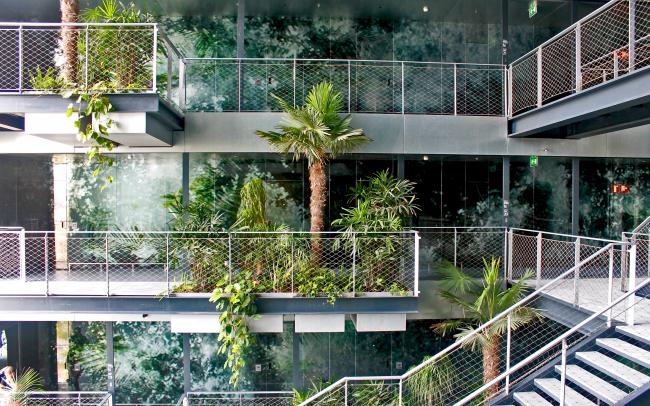 Palm trees and tropical plants on several platforms